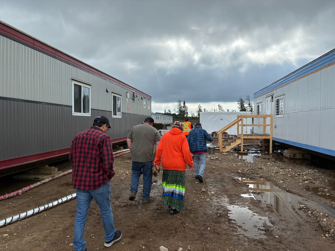 Workers walk through the Ignace construction camp.